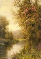 Une vigne en fleurs le long d’un ruisseau sinueux paysage Louis Aston Knight